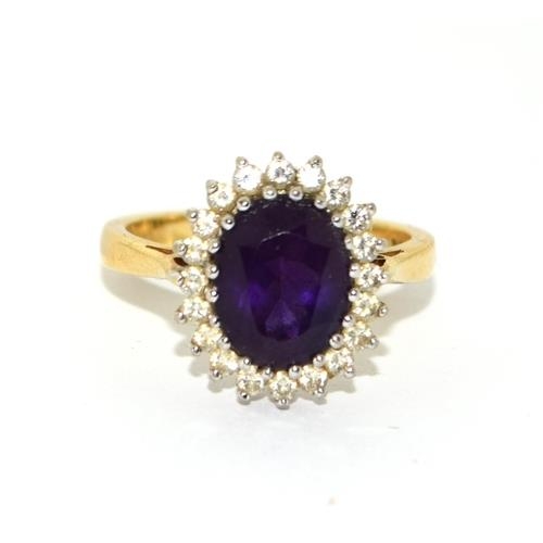 588 - Impressive Princess Diana style Amethyst and Diamond ring in 18ct gold ring has a hall mark as 4ct c... 