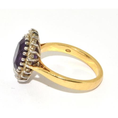 588 - Impressive Princess Diana style Amethyst and Diamond ring in 18ct gold ring has a hall mark as 4ct c... 