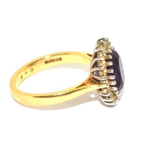 588 - Impressive Princess Diana style Amethyst and Diamond ring in 18ct gold ring has a hall mark as 4ct c... 