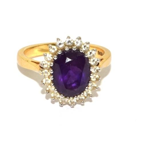 588 - Impressive Princess Diana style Amethyst and Diamond ring in 18ct gold ring has a hall mark as 4ct c... 