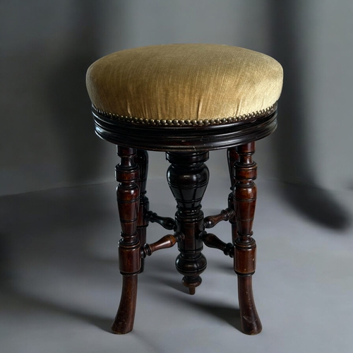 107 - A Victorian upholstered adjustable piano stool.Height - 55cm