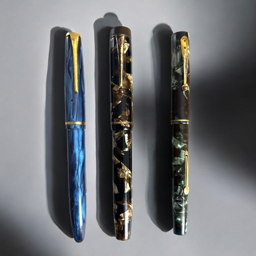 554 - A collection of three vintage fountain pens.Including Watermans ideal, A Mentmore auto-flow 14ct nib... 