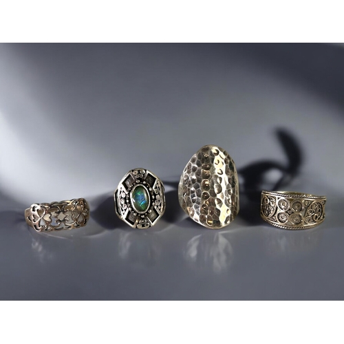 496 - A collection of four silver rings.