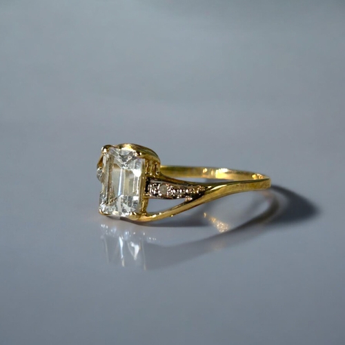 504 - A 9ct Gold, Diamond & clear stone ring.Size - O