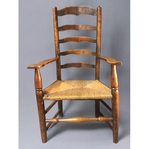 27 - Mid 19th Century Oak and Rush Seated Ladder Back Arm/Reading Chair. Nice dimensions and lovely Patin... 