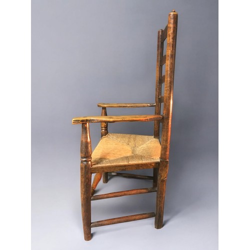 27 - Mid 19th Century Oak and Rush Seated Ladder Back Arm/Reading Chair. Nice dimensions and lovely Patin... 