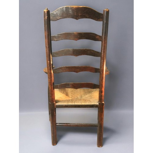 27 - Mid 19th Century Oak and Rush Seated Ladder Back Arm/Reading Chair. Nice dimensions and lovely Patin... 