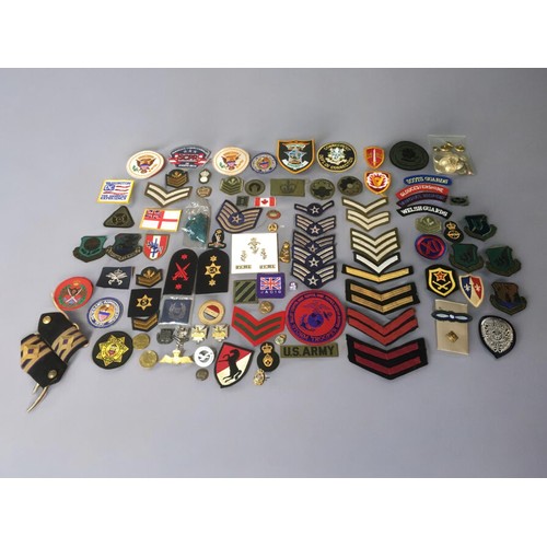 194 - Large Collection of WW2 and Later Military Badges, Buttons, Pins, Cap Badges. British and American. ... 