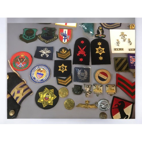 194 - Large Collection of WW2 and Later Military Badges, Buttons, Pins, Cap Badges. British and American. ... 