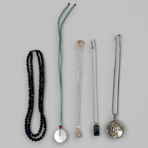 608 - A Collection of 5 silver, jet and jade necklaces.