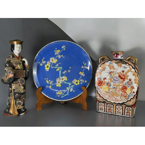 149 - A collection of large Japanese ceramics.Including a large Satsuma figure, enamels painted charger an... 