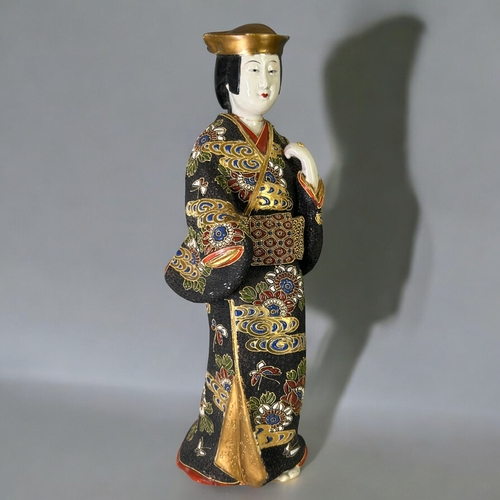 149 - A collection of large Japanese ceramics.Including a large Satsuma figure, enamels painted charger an... 