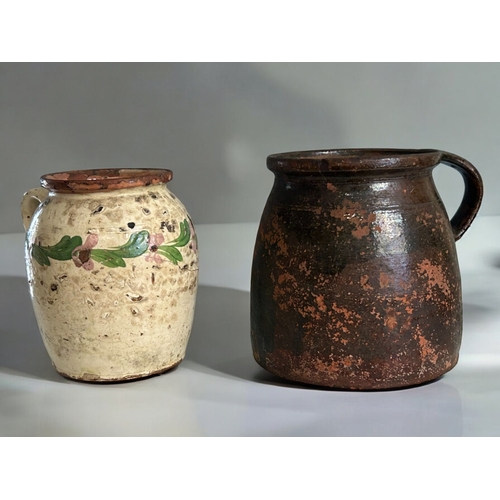 114 - Two antique Hungarian pottery Folk art jugs.Largest - 21cm tall