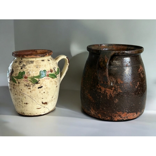 114 - Two antique Hungarian pottery Folk art jugs.Largest - 21cm tall