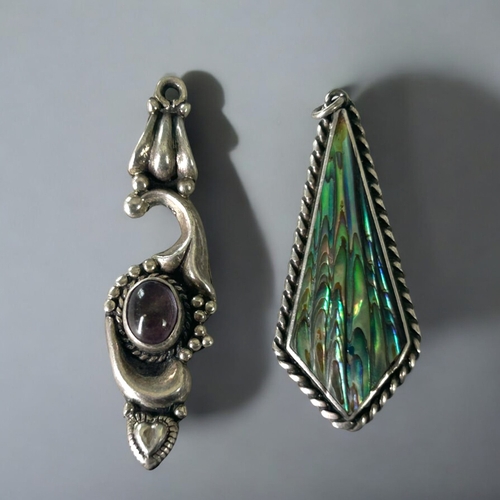 609 - Two silver Art nouveau style pendants.Includes a 'Scottie' brooch and small salt pig.