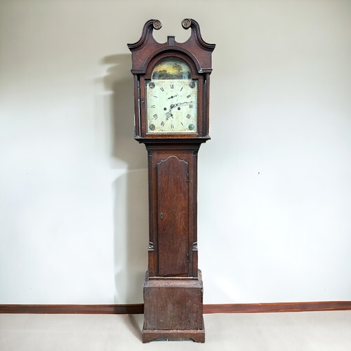 514 - An Oak George III Longcase clock.Arched painted white enamel dial with rural scene and foliate desig... 