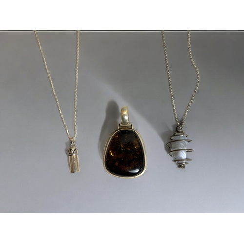 623 - Three silver pendants & chains. Including Amber style pendant.