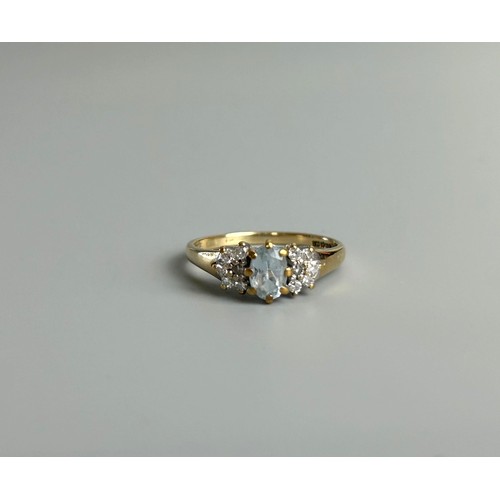 626 - A 9ct gold ring with Aquamarine and Diamonds to shoulder.Approx Size K