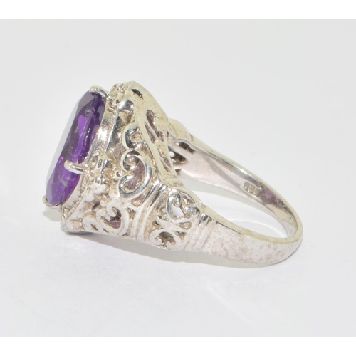 639 - 925 silver Amethyst diamond shape statement ring in an open work scroll design setting size N