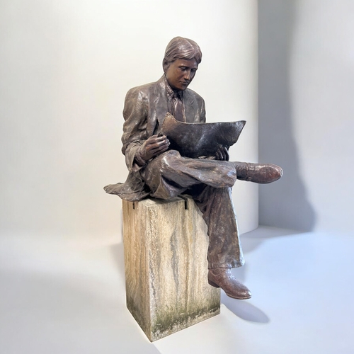 440 - A life size Bronze statue 'The Oxford student'.Depicting a 1930's style student / gentleman reading ... 