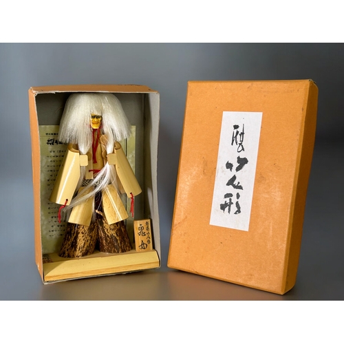 51 - A vintage boxed Japanese Kabuki Noh Noh doll.With original paperwork.