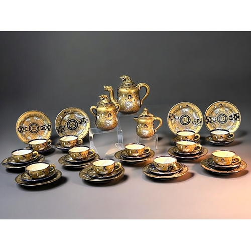 39 - A large Japanese Satsuma 'Dragon' 39 piece Tea set.Hododa Meizan, Meiji period.Serves 12.Gilded Drag... 