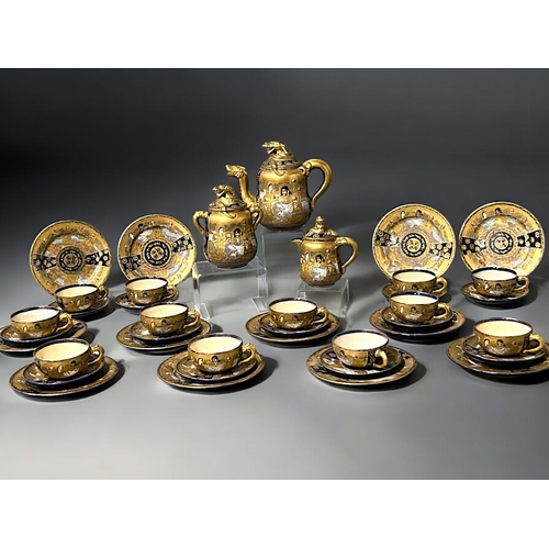 39 - A large Japanese Satsuma 'Dragon' 39 piece Tea set.Hododa Meizan, Meiji period.Serves 12.Gilded Drag... 