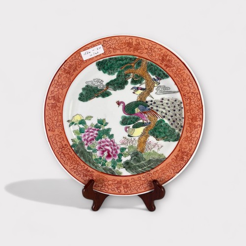 94 - A Chinese porcelain famille verte plate, decorated with peacocks.Diameter - 26.5cm