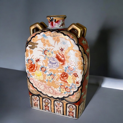 149 - A collection of large Japanese ceramics.Including a large Satsuma figure, enamels painted charger an... 