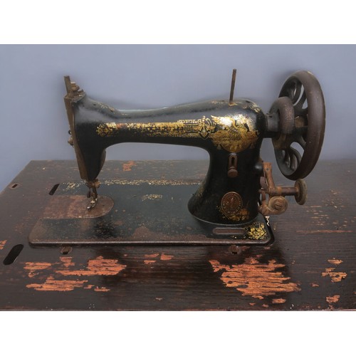 453 - Singer Sewing Machine and Stand Ser No 1679427 Date 1874. Sphinx Decals original and worn.H 74cm x W... 