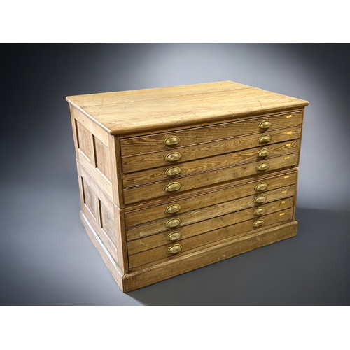 121 - A George V Pitch Pine Government plan chest.Circa 1920.Splits in two, eight drawers with brass cup h... 