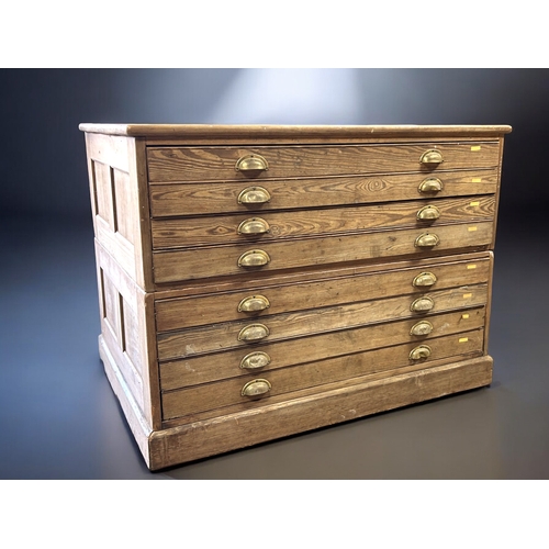 121 - A George V Pitch Pine Government plan chest.Circa 1920.Splits in two, eight drawers with brass cup h... 