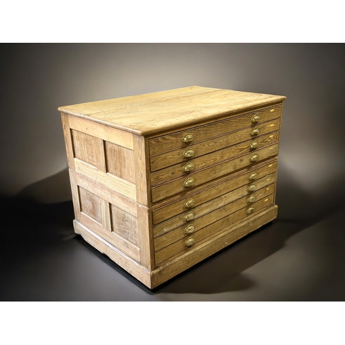 121 - A George V Pitch Pine Government plan chest.Circa 1920.Splits in two, eight drawers with brass cup h... 