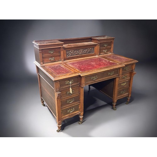 122 - A Victorian pedestal desk.Each pedestal set with three drawers. Further drawers to top gallery with ... 