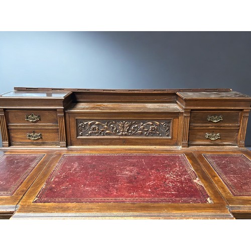 122 - A Victorian pedestal desk.Each pedestal set with three drawers. Further drawers to top gallery with ... 