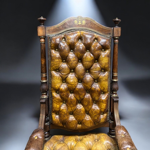 133 - A 19th century carved Rosewood & leather library chair.Leather button back, with carved feet and... 