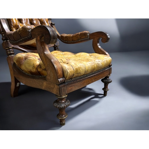 133 - A 19th century carved Rosewood & leather library chair.Leather button back, with carved feet and... 