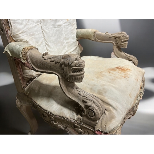 134 - A 19th century French carved Armchair.Carved figural Lion rests, with carved Rococo style rocaille d... 