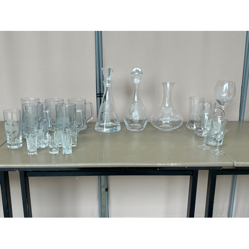 123 - A large collection of military Interest, Deep Cut Glass Decanters, beer mugs, and shot glasses etc. ... 