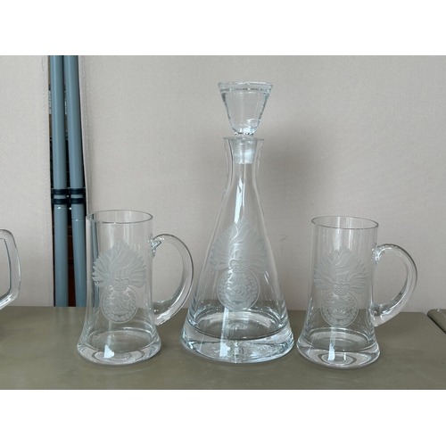 123 - A large collection of military Interest, Deep Cut Glass Decanters, beer mugs, and shot glasses etc. ... 