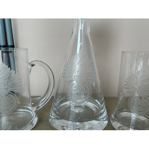 123 - A large collection of military Interest, Deep Cut Glass Decanters, beer mugs, and shot glasses etc. ... 