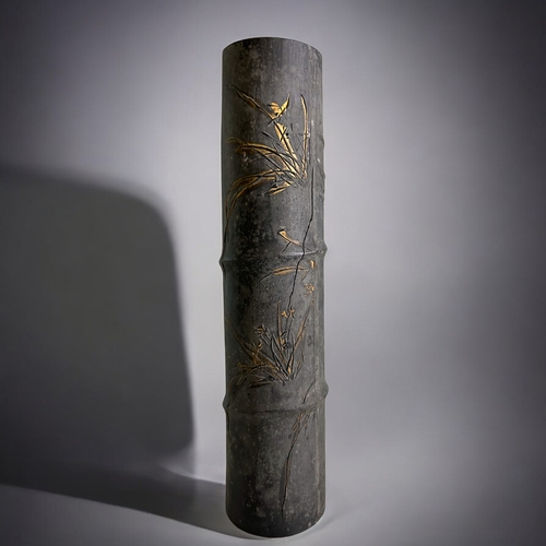 86 - A large Chinese 'Bamboo' form Ink stick.Qing dynasty. Low relief, partially gilded Orchids. With cal... 