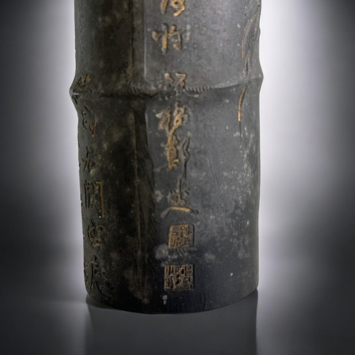 86 - A large Chinese 'Bamboo' form Ink stick.Qing dynasty. Low relief, partially gilded Orchids. With cal... 