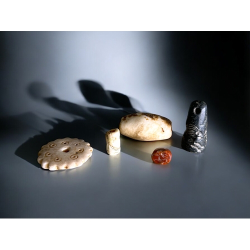 564 - A collection of five ancient Western Asiatic stone seals and beads.Includes conical form seal depict... 