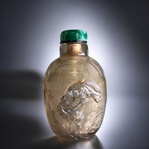 56 - Chinese Smoky Rock crystal snuff bottle.Qing dynasty, 19th century.Carved with a leaping horse below... 