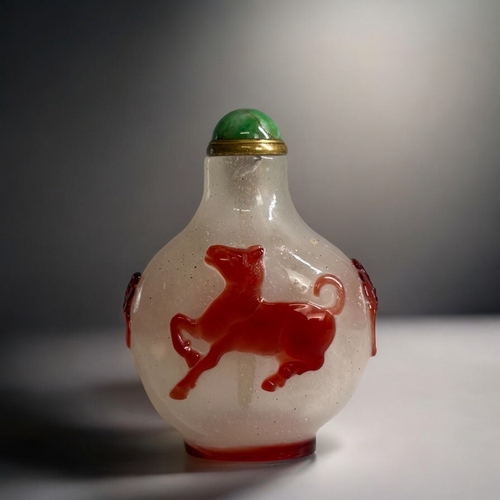 59 - Chinese Red glass overlay on bubble suffused ground Snuff Bottle.  Red glass depicting a horse to bo... 