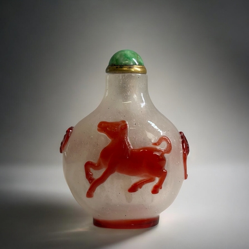 59 - Chinese Red glass overlay on bubble suffused ground Snuff Bottle.  Red glass depicting a horse to bo... 