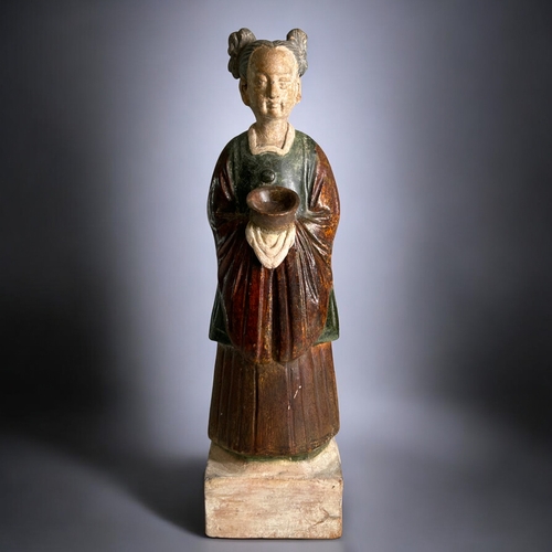 91 - A Chinese Tang style Court attendant.Green & Russet glazed. On raised plinth.Height - 35.5cm... 