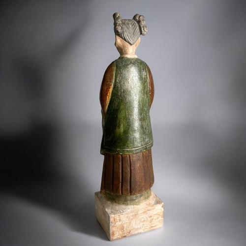 91 - A Chinese Tang style Court attendant.Green & Russet glazed. On raised plinth.Height - 35.5cm... 