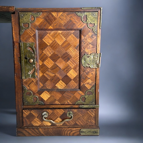 87 - A Japanese Tansu traveling scholar's desk.Meiji period, 19th century.Parquetry design, with twin ped... 